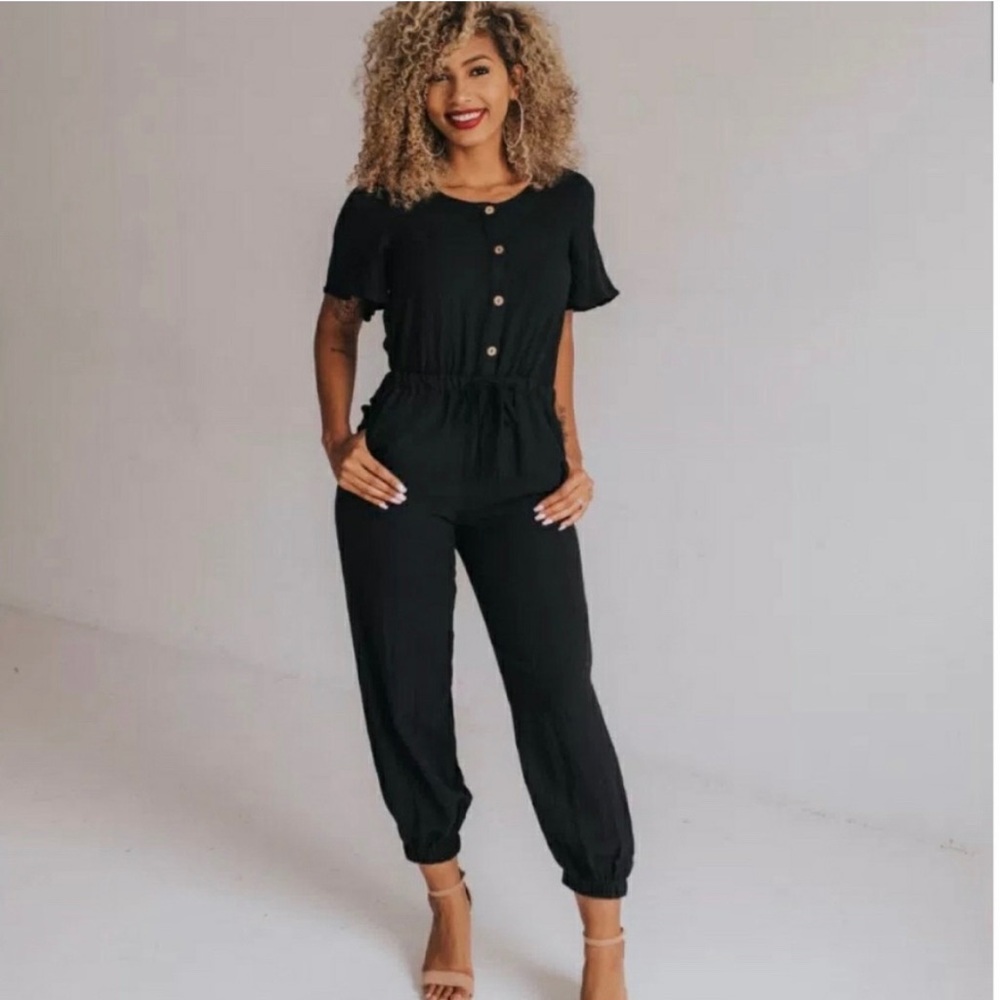 Shop Ashley Lemieux black button up jumpsuit